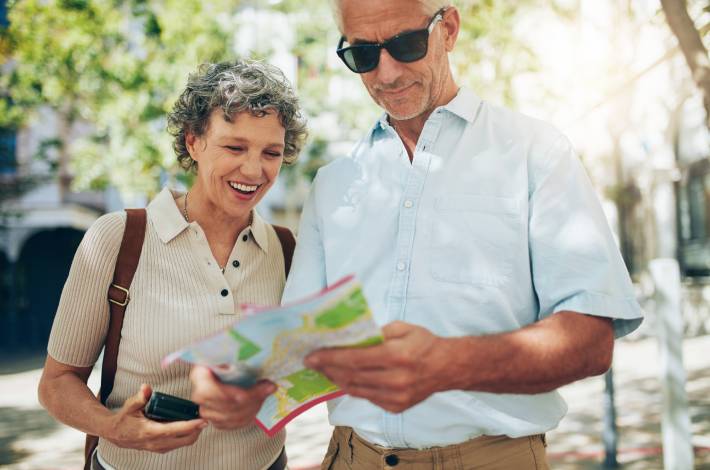 Couple reading a map during a surprise city trip