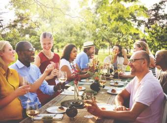 Friend gathering at an outside diner at the end of a GPS tour